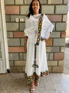 Traditional Ethiopian Dress | Etsy Traditional Embroidered Dress With Geometric Pattern For Festive Occasions, Festival White Habesha Kemis With Woven Motifs, Traditional Embroidered Dress With Geometric Embroidery For Festive Occasions, White Habesha Kemis With Woven Motifs For Festivals, White Habesha Kemis With Woven Motifs For Traditional Ceremonies, White Embroidered Dress With Traditional Patterns, Fitted Embroidered Dress With Traditional Multicolor Patterns, Fitted Embroidered Dress With Multicolor Traditional Patterns, White Embroidered Dress For Traditional Ceremonies