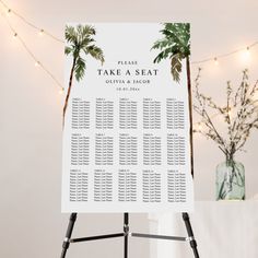 a table plan with palm trees and lights on the wall in front of a white backdrop