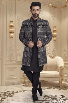 Introducing our exclusive U2-S340 Mens Sherwani. Crafted with the finest thread embroidery, this open jacket exudes sophistication and luxury. Elevate your style and capture attention with this tasteful and elegant piece. Add it to your wardrobe and make a statement at any event. Mens Sherwani, Open Jacket, Thread Embroidery, Elevate Your Style, Your Style, Thread, Embroidery, Wardrobe, Black