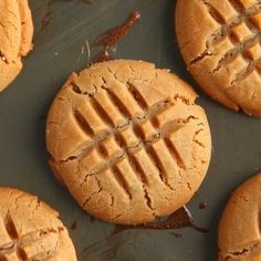 peanut butter cookies are arranged on a baking sheet