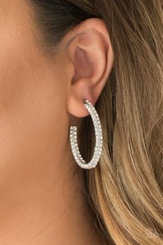 Glassy white rhinestones are encrusted along three sides of an abstract silver hoop for a glamorous look. Earring attaches to a standard post fitting. Hoop measures 1" in diameter. Sold as one pair of hoop earrings. Paparazzi Jewelry Images, Jewlery Earrings, Paparazzi Accessories Jewelry, White Hoop Earrings, Glamorous Look, Paparazzi Accessories, White Rhinestone, Fabulous Jewelry, Big Earrings