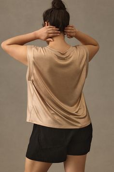 Polyester, elastane Pullover styling Hand wash Imported | Shine Muscle T-Shirt by Porridge in Gold, Women's, Size: XL, Polyester/Elastane at Anthropologie Versatile Stretch Tops For Loungewear, Stretch Tops For Loungewear, Athleisure Tops With Minimal Stretch For Loungewear, Chic Relaxed Fit Tops Made Of Modal, Chic Soft Stretch Tops For Layering, Chic Relaxed Fit Modal Tops, Stretch Modal T-shirt For Summer, Stretch Scoop Neck Top For Loungewear, Chic Stretch Tops For Loungewear