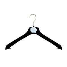 a black hanger with white flowers on it