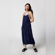 Midi Dress From Uo With Cinched Detailing Through The Bodice And At The Hem. Cut In An Easy Fit With A Lightly Scooped Neckline. Finished With A T-Strap Detail At The Low-Cut Back. Features - Cinched Uo Midi Dress - Relaxed Fit - Adjustable Ties At The Sides + Hem - 100% Polyester Size + Fit - Model In Navy Is 5’8" And Wearing Size Small - Measurements Taken From Size Small - Length: 51" Summer Maxi Dress With Drawstring For Day Out, Summer Maxi Dress With Drawstring, Flowy Maxi Dress With Drawstring, Flowy Drawstring Maxi Dress, Summer Maxi Dress With Drawstring For Vacation, Summer Midi-length Dress With Drawstring, Summer Midi Length Dress With Drawstring, Summer Midi Dress With Drawstring, Summer Beach Midi Dress With Drawstring