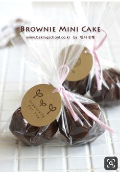 three brownie mini cakes wrapped in cellophane