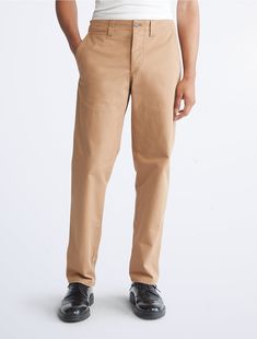 A modern design, updated with a utilitarian-inspired look. These Calvin Klein chinos are crafted from pure cotton in solid fabric with multiple pockets and a straight leg fit. Tigers Eye, Tigers, Pure Cotton, Khaki Pants, Calvin Klein, Straight Leg, Modern Design, Pure Products, Pants