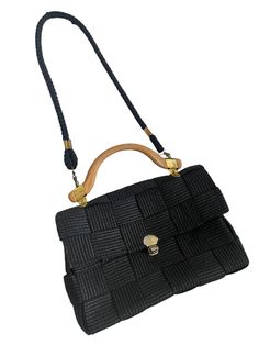 Vintage Womens 1970s Black Woven Shoulder Bag/Handbag Such a great versatile bag, Can be worn both ways Very roomy and makes the perfect everyday bag Woven Textured Black Fabric body with rubberised wood look handle and gold detailing Opens with clasp with a canvas style lining Bag Body Measurements Length of strap Width across 13 Inch, Length down 9 Inch, Depth 3 Inch Vintage Rectangular Flap Bag With Gold-tone Hardware, Black Handheld Flap Bag With Gold-tone Hardware, Vintage Rectangular Flap Bag With Detachable Handle, Evening Flap Shoulder Bag With Handles, Vintage Satchel Flap Bag With Detachable Handle, Black Shoulder Flap Bag With Handles, Retro Black Crossbody Satchel, Vintage Evening Flap Bag, Retro Shoulder Bag With Gold-tone Hardware For Travel