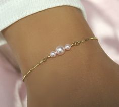 Pearl Bracelet is available in gold, rose gold or silver and 3 style choices.  Choose from ten pearl color options, ranging from classic white and soft blush to deep burgundy and rich champagne, allowing you to personalize your bracelet to match your unique style and personality. IT'S IN THE DETAILS ✦ Gold, Rose Gold or Silver Adjustable Box Chain Bracelet ✦ Your choice of 3 styles and 10 color pearls Style A - 6mm Swarovski Pearls Style B -  4 and 6mm Swarovski Pearls Style C - 4mm, 6mm and 8mm Minimalist Adjustable Pearl Bracelet For Party, Adjustable Rose Gold Minimalist Pearl Bracelet, Rose Gold Pearl Bracelet As Gift, Elegant Pink Pearl Bracelet As A Gift, Elegant Pink Pearl Bracelet For Gifts, Elegant Pink Pearl Bracelet Gift, Dainty Rose Gold Pearl Bracelet, Elegant Pink Hypoallergenic Bracelet, Elegant Pink Gold Bracelets As Gift