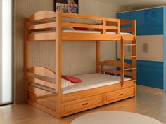 there is a bunk bed in the room with drawers on the bottom floor and a table underneath it