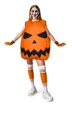 a woman dressed as a pumpkin costume