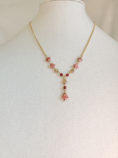 "This Pink Flower Necklace will have you looking as cute as can be. A Spring Flower Necklace is the perfect gift to get your loved one ready for any sunny.  SIZE  *Necklace Length - 20\" *  ITEM DETAILS  *Materials - Gold, Glass *Coral pink Czech Lily flower beads with transparent pink stars and red Czech faceted glass beads are the focal of this unique Czech Beaded Necklace. *       These Czech beads are linked together using gold  accents and are attached to a small gold rolo link chain to com Valentine's Day Flower Necklace With Adjustable Fit, Gold Beaded Necklaces With Flower Charm, Red Flower-shaped Beaded Necklaces For Gifts, Flower Pendant Beaded Necklace For Gift, Gold Beaded Necklaces With Flower Charm As Gift, Beaded Chain Necklace With Flower Pendant For Gifts, Gold Beaded Necklace With Flower Charm As Gift, Gold Beaded Necklace With Flower Charm For Gift, Flower Pendant Necklace With Beaded Chain For Gift