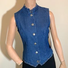 Vintage Stonebridge Petites Denim Vest, Nwt, 100% Cotton, Studded Trim At Neck And Bottom. Never Worn. Fitted Medium Wash Denim Top With Button Closure, Fitted Denim Blue Jeans With Snap Buttons, Trendy Fitted Blue Denim Vest, Classic Fitted Washed Blue Denim Top, Fitted Medium Wash Denim Vest With Button Closure, Fitted Washed Blue Tops With Snap Buttons, Fitted Denim Vest With Button Closure, Fitted Denim Top With Button Closure, Fitted Jeans With Snap Buttons