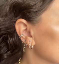 Introducing our Biggie Baguette Ear Cuff: an exquisite creation made of 14K Yellow Gold, embellished with .64 CTS of dazzling white baguette diamonds set in an alluring channel. This opulent, stand-alone piece effortlessly elevates any ensemble with its captivating diamond brilliance, providing a touch of sophistication and glamour. No piercing required. Available in White or Rose gold by special order Each piece is sold separately. Elegant White Jewelry With Baguette Diamonds, Luxury White Gold Baguette Jewelry, White Gold Baguette Jewelry With Single Cut Diamonds, Timeless Cubic Zirconia Jewelry With Baguette Diamonds, Sparkling Diamond Jewelry For Evening, Evening Sparkling Diamond Jewelry, Luxury Sparkling Jewelry For Evening, Fine Jewelry Diamond Baguette, Luxury 14k Gold Jewelry With Baguette Diamonds