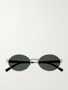 Taking cues from popular '90s styles, SAINT LAURENT's oval-frame sunglasses are re-imagined to suit the sleek modern aesthetic. They're made from silver-tone metal and have black lenses that match the acetate tips and the label's moniker etched along the arms. Sunglasses 90s, Ysl Sunglasses, Metal Sunglasses, Eyewear Womens, Oval Sunglasses, Oval Frame, Round Frame, Modern Aesthetic, Sunglass Frames