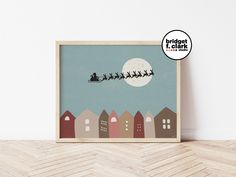 a wooden frame with an image of santa's sleigh in the sky