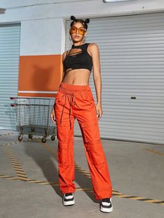 Make a bold fashion statement with these Orange Waist Flap Pocket Cargo Pants. Their plain pattern and high waistline add a touch of sophistication to your casual look. The drawstring waist ensures a comfortable fit, while the non-stretch fabric offers durability. These long-length pants are ideal for any occasion, and the waist flap pockets add a trendy twist. Details: Color: Orange Style: Casual Pattern Type: Plain Type: Cargo Pants Closure Type: Drawstring Waist Waist Line: High Waist Length: Orange Stretch Bottoms For Streetwear, Trendy Loose Fit Cargo Pants Ankle-length, Trendy High Waist Drawstring Bottoms, Trendy High-waisted Bottoms With Drawstring, Urban Style Drawstring Bottoms For Summer, Trendy High Waist Parachute Pants With Elastic Waistband, Sporty Orange Bottoms With Drawstring, Trendy Long Pants With Drawstring, Sporty High-waisted Cargo Pants For Spring