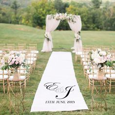 an outdoor wedding ceremony with white and pink flowers on the aisle, decorated with gold chairs