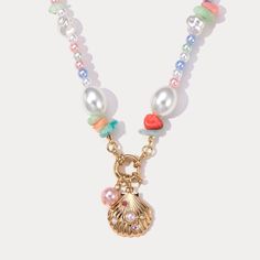 Bring the joy of summer to your wardrobe with our Sea Shell Pearl Necklace! Channel your inner mermaid with this necklace, featuring an assortment of sea shells, ceramic beads, and freshwater pearls., which will surely light up your eyes and add a cheerful touch to any outfit. Embrace the beauty of the sea and add a touch of whimsy to your style. DETAILS Plating: 18K Gold on Alloy Materials: Alloy, ABS Pearl, Shell, Cubic Zirconia Measurements: Length: 16.9"(43cm) Weight: 24g Everyday Wear Jewelry, Astrology Jewelry, Astrology Necklace, Moon And Star Ring, Moon And Star Earrings, Nature Earrings, Nature Necklace, Jewelry Lockets, Jewelry Accessories Ideas