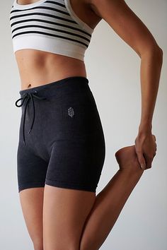 Your new favorite workout shorts, featuring a seamless, ribbed fabrication in a flattering high-rise silhouette with an adjustable waistband for a stay-put fit while you move. **Fit:** Fitted; high-rise; shorty length **Features:** Super soft, ribbed fabrication; low-impact compression; seamless construction; drawstring adjustable waistband **Best For:** Low-impact workouts | Go To Rib Shorts by FP Movement at Free People, Washed Black, M/L Sporty Ribbed Yoga Bottoms, Ribbed Short Activewear For Workout, Ribbed Short Length Activewear For Workout, Ribbed Activewear For Workout, Sporty Seamless High-waisted Shorts, Sporty Stretch Ribbed Shorts, High-waisted Workout Shorts With Seamless Construction, Athleisure Ribbed Sports Shorts, Sporty High-waist Seamless Shorts