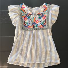 L Love Short Sleeved Embroidered Peasant Top. Size Small. New Without Tags. Casual Multicolor Embroidered Beach Top, Casual Multicolor Embroidered Tops For The Beach, Spring Beach Embroidered Blue Top, Spring Blue Embroidered Top For Beach, Casual Blue Embroidered Short Sleeve Top, Blue Embroidered Top For Spring Beach Occasion, Blue Casual Embroidered Top For Vacation, Blue Floral Embroidery Top For Vacation, Casual Blue Embroidered Top For Vacation