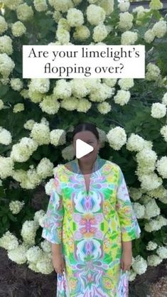 a woman standing in front of flowers with the caption are you limelight's hopping over?