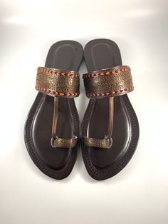 * Please note that if you have wide feet, you will need to size up*  dhaage.london We Bring you our latest collection.  These beautiful Kolapuri Chappal are Handcrafted, incredible soft and anti slip sole. Comfort and style all in one.   . . . #jutti #khussa #shoes #punjabishoes #juttilovers #summer #desiclothes #casualshoes #indian #pakistani #desi #fashion #desifashion #kaleeray #accessories #tradionalshoes #handmade #summer #summervibes #wedding #desiwedding #partywear #eid #simplekhussa #pak Traditional Sandals With Single Toe Strap For Festive Occasions, Traditional Festive Sandals With Single Toe Strap, Traditional Closed Toe Toe Ring Sandals For Festivals, Traditional Slip-on Sandals For Festivals, Festive Sandals With Gota Work And Single Toe Strap, Traditional Open Toe Sandals For Festivals, Festive Closed Toe Sandals For Puja, Traditional Multicolor Sandals With Round Toe, Traditional Festive Sandals For Puja