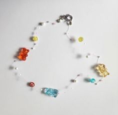 (Necklace is NOT stretchy. For longelivity please refrain from pulling hard on the necklace or getting it wet.) Clear Single Strand Necklaces For Gift, Single Strand Clear Necklace For Gift, Clear Single Strand Necklace For Gifts, Clear Single Strand Necklace For Gift, Invisible Necklace, Gummy Bear Necklace, Illusion Necklace, Floating Necklace, Bear Necklace