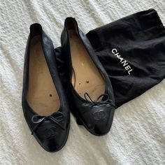 -Classic Ballerina Flats -Black Leather -Black Leather Bow -Classic Black Patent Toe -Cc Symbol On Toe -Mini Heel -Size: 38 / Us: 7 Condition: Well Loved, Lots Of Life Left. Leather Is In Great Condition, Patent Toes Have Little Scuffing, Interior Lining Is Dingy, Bottom Exterior Soles Have Heel Replacement. Black Chanel Ballet Flats, Leather Bow, Leather Bows, Leather Ballet Flats, Ballerina Flats, Chanel Black, Chanel Shoes, Ballet Flat, Chanel Ballet Flats