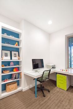 a home office with two desks and bookshelves