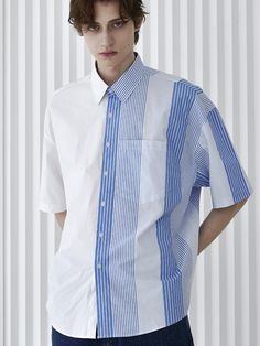 Editor's Notes This shirt with a solid color on one side and striped design on the other half is constructed of a solid pocket detail and a premium cotton fabric. S SY's tee is made in a mid-weight, durable cotton that gets softer over time. Perfect for everyday use.- Oversized fit- Straight silhouette- Striped half and half detail- Solid- pocket detail- Premium fabricMeasurements(in.)M / L- Total length (front): 30.71 in. / 31.10 in. - Total length (back): 31.69 in. / 32.09 in. - Blue Cotton Shirt With Contrast Stripes, Casual Blue Shirt With Signature Stripes, Blue Cotton Shirt With Signature Stripes, Blue Shirt With Contrast Stripes For Summer, Casual White Shirt With Signature Stripes, Cotton Workwear Top With Striped Sleeves, Cotton Top With Striped Sleeves For Work, White Shirt With Signature Stripes For Spring, Striped Short Sleeve Shirt With Pockets