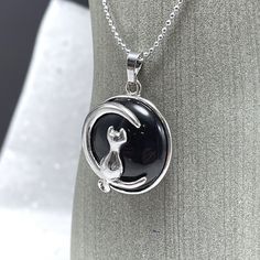 "A delightful image of a kitty cat basking in moonlight is paired with the healing vibration of natural gemstones.  18\" silver metal chain Pendant is about 1\" in diameter Gemstone Meanings: Black onyx:  Gives strength - Promotes vigor, steadfastness and stamina - Brings courage - Imparts self-confidence - Banishes grief - Enhances self-control - Heals old emotional wounds - Stimulates the power of wise decision-making - Encourages happiness and good fortune - Helps to fight basic fears and to Moon Cat, Healing Vibrations, Bad Relationship, Gemstone Meanings, Cat Pendants, Cat Necklace, Self Control, Gemstone Necklace Pendant, Chain Pendant