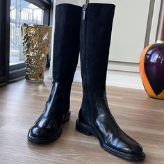 - Designer = Jill Sander - Size = 8m(38). Trunk 10 - Color Black - Jill Sander Made In Italy 1leather & Suede Trim 8m(38) Black Riding Boots - Heel Height = 1” Inch - Leather Interior Lining And Leather Outsole - Measured Underneath Outsole From Tip Of Front Of Shoes To Back Tip Of Heel To Give An Estimate Of Size 1length =Approximately 28cm - Circumference Measured At Top Tip Of Boots All Around At One Point And Back = Approximately 34cm - Side Functional Zip - Circumference Measured Around Shi Classic Black Boots With Suede Lining, Elegant Winter Moto Boots With Leather Sole, Classic Black Fitted Knee-high Boots, Black Leather Sole Knee-high Boots For Fall, Elegant Leather Sole Knee-high Boots For Riding, Black Low Heel Knee-high Boots For Winter, Fitted Black Boots With Flat Heel, Black Wide Calf Knee-high Boots With Flat Heel, Black Flat Heel Knee-high Boots With Wide Calf