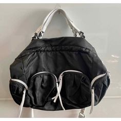 Aj Valenci Large Black Summer Bag With White Straps And White Trim. Great Summer Bag. Double Handles Plus A Longer 43" White Strap That Can Be Removed. Would Be Great As A Beach Bag, Gym Bag Or Mom Bag. Clasp Closure. There Are 4 Large Outer Pockets (6' X 6' Each) That Are Roomy And Great For Accessories, Makeup, Etc. One Large Interior Zipper Pocket Plus Two Open Pockets. Approximately 13" High X 19" Wide. See Photos. New Without Tags. Final Sale. Please Review Photos Before Purchase. Thank You! Black Nylon Shoulder Bag For Errands, Black Nylon Hobo Bag With Adjustable Strap, Functional Black Hobo Bag For On-the-go, Black Tote Diaper Bag With Zipper Closure, Black Diaper Bag With Zipper Closure For On-the-go, Black Nylon Hobo Bag Shaped As A Tote, Black Nylon Hobo Bag For Daily Use, Everyday Black Nylon Hobo Bag, Black Nylon Everyday Diaper Bag