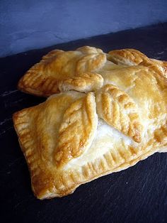 two pieces of pie sitting on top of a table