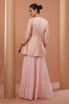 Peach three fourth sleeves V neck kurta with all over gullista zardozi embroidery using beads, sequins, cutdana highlights and honeycomb woven details. Paired with a floret motif embroidered flared sharara. - Aza Fashions Festive Fitted Sets With 3/4 Sleeve, Festival Embellished Straight Kurta Set, Pink Sequined Kurta For Festivals, Navratri Long Sleeve Embellished Kurta, Embellished Straight Kurta Sets For Transitional Season, Long Sleeve Embellished Kurta For Navratri, Embellished Long Sleeve Kurta For Navratri, Transitional Embellished Straight Kurta Set, Long Sleeve Choli With Intricate Embroidery