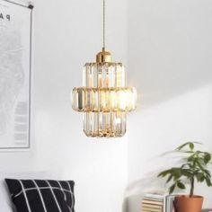 a chandelier hanging from the ceiling in a living room