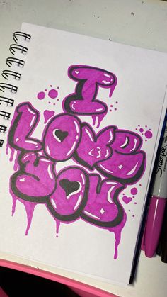 a notebook with graffiti written on it and purple ink splatters all over the page