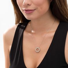 Complement any attire with this stunning diamond circle pendant. Fashioned in sterling silver and 14K gold plate, this open circle shimmers with diamonds - each artfully set to enhance size and sparkle. A gold-plated rope-textured border gleams along the inside. Radiant with 1/20 ct. t.w. of diamonds and a brilliant buffed luster, this pendant suspends along an 18.0-inch box chain that secures with a spring-ring clasp. Elegant Silver Open Circle Necklace, Elegant Open Circle Silver Necklace, Diamond White Halo Round Pendant Jewelry, Diamond White Jewelry With Halo Round Pendant, Diamond White Halo Jewelry With Round Pendant, Silver Diamond Halo Necklace For Anniversary, Modern Halo Diamond Jewelry, Fine Jewelry Diamond Necklace With Halo For Anniversary, Elegant Sterling Silver Halo Diamond Necklace