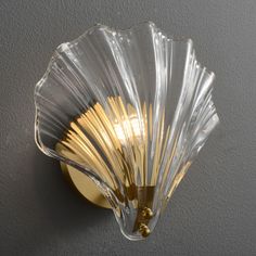 The shell wall lamp is a beautiful decoration on the wall. The modern glass lights are in the shape of seashells and made of batter and glass. This vintage design lamp is available in two color options including transparent and brown (amber). The shell shape glass wall light is suitable as a decorative light in halls, porches and bathrooms, but also as a light in the bedroom at the head of the bed. This modern design glass wall sconce can bring an elegant and romantic melody to your room. Wall Mount Light, Wall Lamps Living Room, Indoor Lighting Fixtures, Glass Wall Lights, Light Style, Mount Light, Wall Mounted Light, Modern Glass, Light Wall