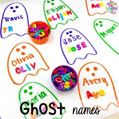 halloween ghost name tags on a sheet of paper with crayons and colored letters