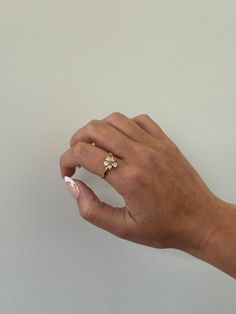 Flower ring - This adjustable dainty flower ring is incredibly stunning. Made to sparkle and shine on any finger! A perfect gift for women, girlfriend, best friends, sisters, moms. A perfect option for those who like minimal dainty gold rings and want to have the perfect size. - gold filled- stainless steel and gold- cz stones- Style: Minimalist Dainty 14k Gold Flower Ring For Wedding, Delicate Spring Flower Ring, Delicate Flower Ring For Spring Gift, Delicate Jewelry For Anniversary In Spring, Delicate Jewelry For Spring Anniversary, Adjustable Flower Ring For Spring Wedding, Delicate Spring Jewelry For Anniversary, Delicate Spring Flower Ring Gift, Dainty Adjustable Rings For Promise Occasion