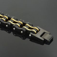 Biker Proud™ motorcycle chain bracelet in black and gold • Metal type - 316 L stainless steel• Double safety clasp• Environnemental - lead & nickel free (100% allergy free)• Width 1.6 cm (.62 in), Length: 22 cm (8.66 in)• Weight: 116 g (4.14 oz) Delivery: 1-4 weeksThis product ships to you directly from our US or overseas supplier Motorcycle Chain Bracelet, Bike Chain Bracelet, Biker Chain, Steel Bicycle, Mens Chain Bracelet, Motorcycle Chain, Black Gold Chain, Bangles Gold, Handmade Leather Bracelets