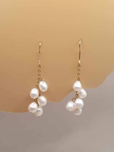 DESCRIPTION: Elegant, long freshwater pearl drop earrings with gold dangle design, perfect for bridal and wedding jewelry. These timeless earrings make a beautiful bridesmaid gift and add sophistication to any outfit. BEST FEATURES: Crafted with high-quality, lustrous freshwater pearls for a luxurious look. Classic gold dangle setting complements any bridal or formal attire. Designed for all-day wear without compromising comfort. Perfect for weddings, special occasions, or everyday elegance. Met Long Drop Pearl Earrings For Anniversary, Anniversary Long Drop Pearl Earrings, Briolette Pearl Charm Earrings For Weddings, Briolette Pearl Earrings For Wedding, Pearl Drop Briolette Earrings For Wedding, Timeless Earrings, Pearl Drop Earrings Gold, Formal Earrings, Sophisticated Jewelry