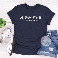 Show your love to your family with our personalized family shirts. This Auntie shirt is based off the Friends TV Show. Perfect Gift for Aunt who is a Friends addict. Choose your favorite shirt from a wide variety of unique high quality designs and colors. Cotton Tops With Name Print For Family Reunion, Funny Cotton T-shirt For Family Reunion, Casual Customizable T-shirt For Family Gatherings, Funny Customizable Tops For Family, Customizable Blue Tops For Family Occasions, Casual Tops With Custom Print For Family Gatherings, Cotton Top For Family Gatherings On Father's Day, Cotton Tops For Family Gatherings On Father's Day, Father's Day Graphic Print Tops For Family Gatherings