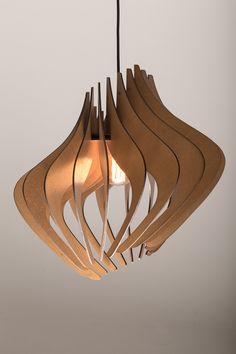 a wooden light fixture hanging from a ceiling