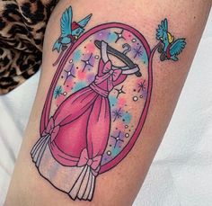 a woman's leg with a pink dress and birds on it, surrounded by stars