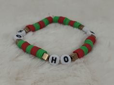 🎄 A handmade Christmas themed bracelet, a perfect children's gift for Christmas! 🎅 Festive Adjustable Personalized Bracelets, Handmade Green Beaded Bracelets For Holidays, Adjustable Stretch Bracelet Gift For Christmas, Multicolor Christmas Gift Bracelets, Adjustable Green Beaded Bracelets For Holiday, Multicolor Bracelet For Holiday Gift, Handmade Green Bracelets For Holiday, Personalized Beaded Bracelets For Christmas Gift, Adjustable Bracelets For Christmas Holiday