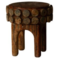 an old wooden stool with circles on it