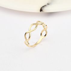 ➤MATERIALS ABOUT GOLD PRODUCT Material: 14K Gold, Real Gold. We don't use plated gold or filled gold in our products. Gold Karat: 14 Karat Gold (585). Ring Colours: 14K Yellow Gold, 14K Rose Gold, 14K White Gold. ★INFORMATION ABOUT GOLD RING Handmade with 14 karat real gold. You can order this ring with 3 different colour options and 9 different size options, free express shipping to the all-around the world. ✈️ABOUT DELIVERY Your order will be crafted and ready to ship within 1 - 3 business day Gold Stackable Rings With Modern Twist In Infinity Shape, Gold Stackable Infinity Rings With A Modern Twist, Gold Infinity Stackable Rings With A Modern Twist, Modern Twist Gold Infinity Stackable Rings, Gold Infinity Ring With A Modern Twist, Modern Gold Infinity Rings, Modern Twist Gold Infinity Ring, Dainty Gold Infinity Stackable Rings, Gold Infinity Stackable Rings As Gift