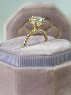 an engagement ring in a velvet box